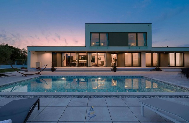 Luxury retreat for 8 guests, with pool surrounded by olive trees