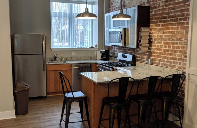 Modern 2-bedroom apartment with cozy fireplace, walkable village location!