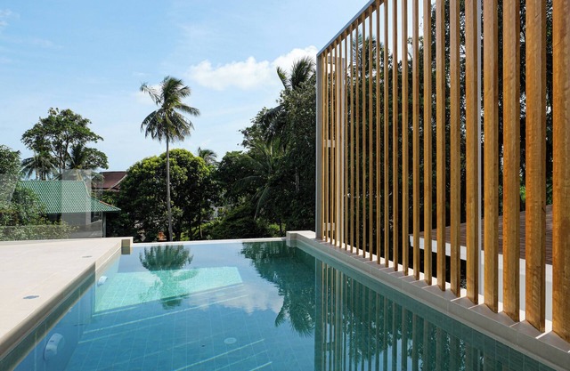 Modern 2-bedroom villa with private pool, office space, and lush surroundings
