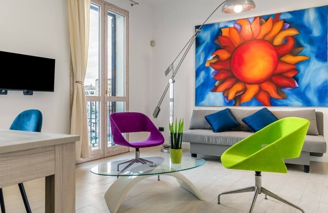 Modern 83 sqm apartment, perfect for 5 people, located on the second floor of an ancient building (NO lift and some steps to access it). The property is located in La Cala, a picturesque port located in the heart of Palermo, just 12 minutes on foot from