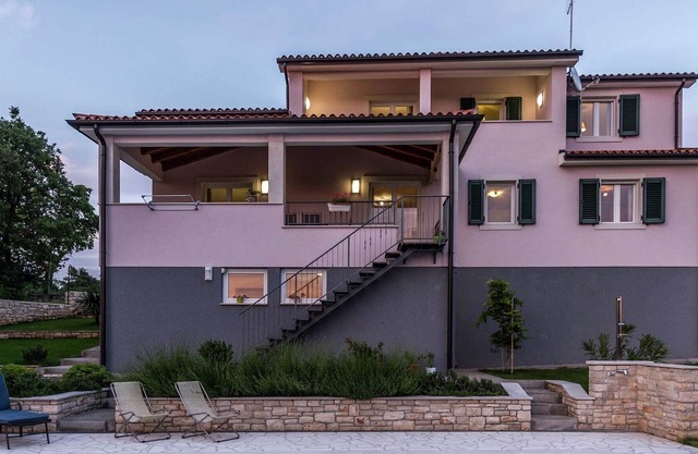 Modern and luxury house, situated on a private plot with large garden and pool