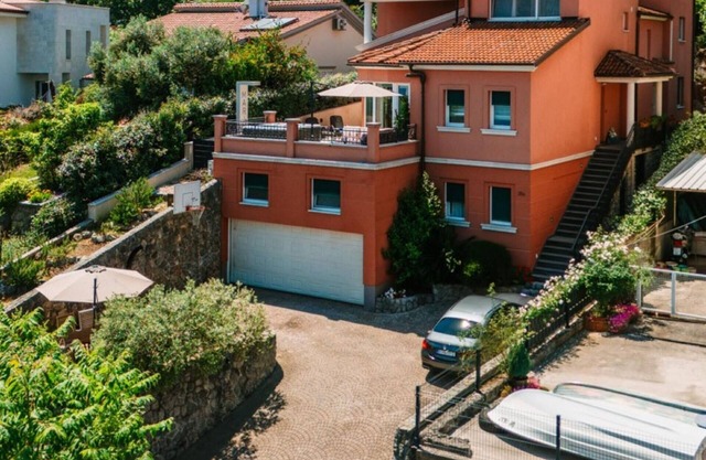 Modern apartment with an open gallery and a balcony with a sea view to the side