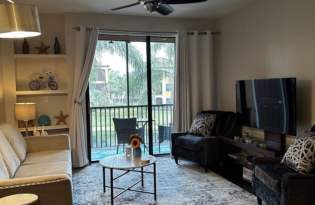 Modern condo in resort style gated community with large pool, gym, tennis, bbq.