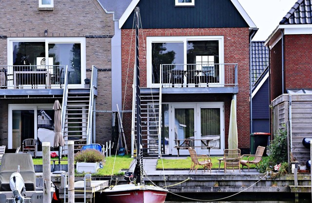 Modern house with high terrace & garden on private canal & jetty