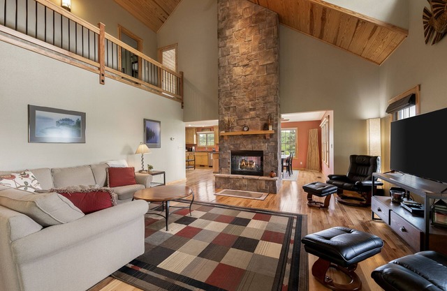 Multi-level home with a game room, washer/dryer, fireplace, deck & central AC