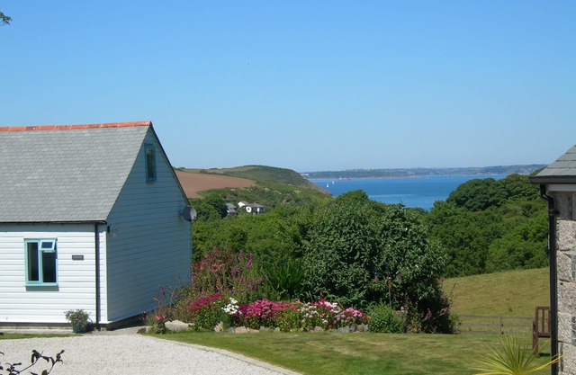 Nanteague - quirky luxury chalet-style cottage, sea views across a wooded valley