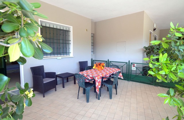 New apartment with large covered patio and parking space convenient to the sea