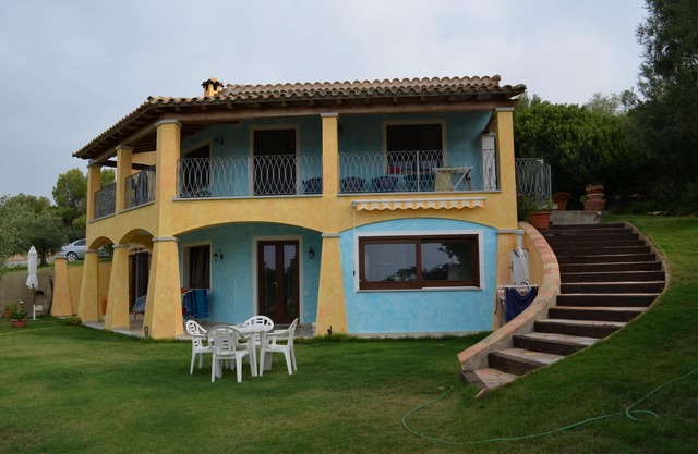 Nice two-room apartment with large garden with green lawn and vegetation