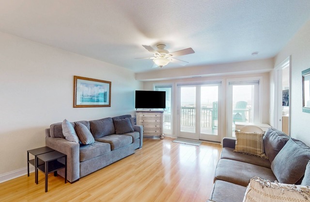Ocean view condo with pool access, furnished balcony, & central AC