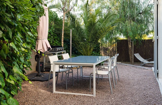 On a quiet garden level, a few steps away from the beach
