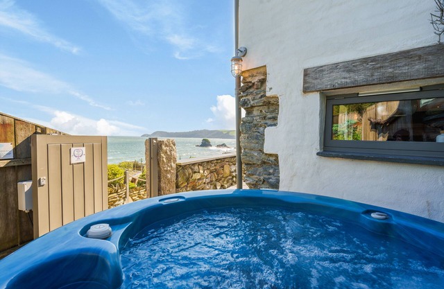 ON AMAZING SPACES! Luxurious Beach Front Retreat with Hot Tub & Log Burner
