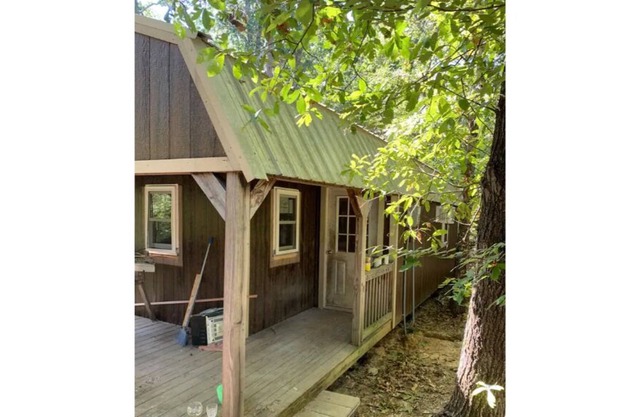 PINE TREE CABIN Cute cabin nestled in the woods.