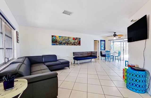 Private home on the canal with dock, screened pool, patio, AC, & W/D - dog-friendly
