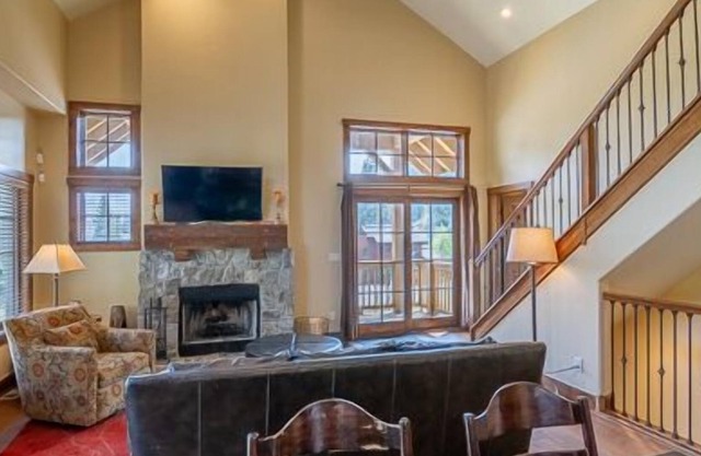 Private Hot Tub | Cozy Living Room with Stone Fireplace | Modern Granite Kitchen