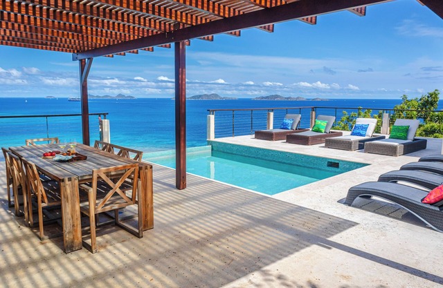 Private villa for 8 with breathtaking views and multiple living spaces.