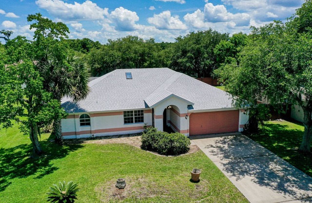 Quiet home with enclosed yard, heated pool with jets, & screened lanai