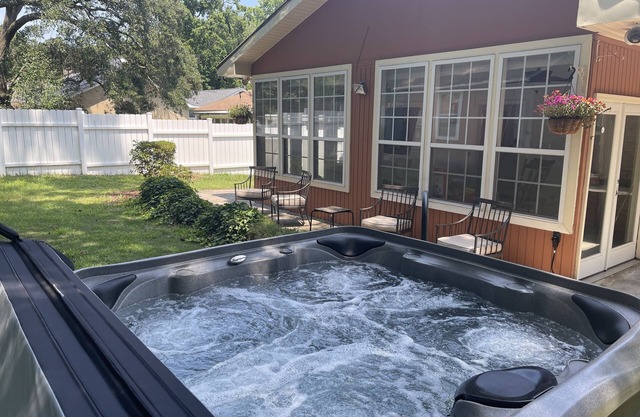 Relaxing Mediterranean style home w/hot tub, 2 golf carts, private beach access