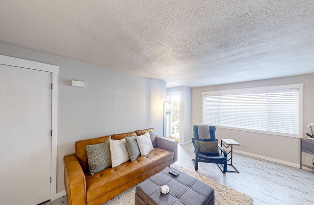 Renovated condo with covered porch, grill, & private washer/dryer