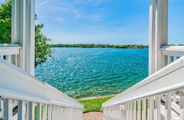 Resort style living in a modern condo directly on the waterfront, sunset views