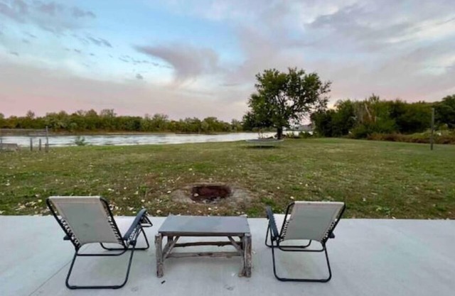 Riverfront Studio Cabin w/Sunset View, Wi-Fi, Yard, and Fire-pit!