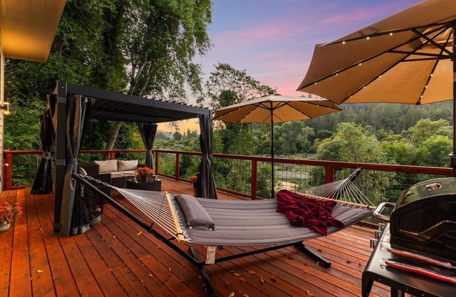 Romantic Contemporary home with shaded Riverfront and home office