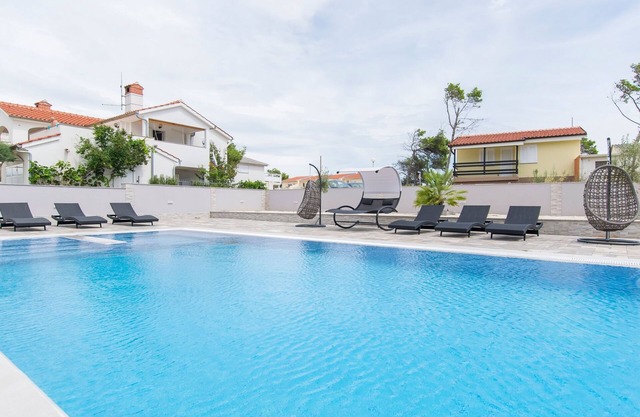 Seaside family friendly house with a swimming pool Vir (K-24816)