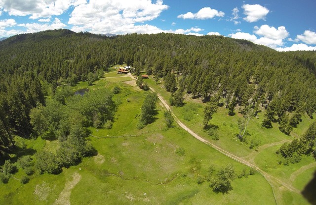 SECLUDED CABIN ON 65 ACRES SURROUNDED BY NATIONAL FOREST CLOSE TO HELENA
