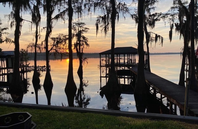 Secluded lake front w/private dock, boat lift, large screened porch