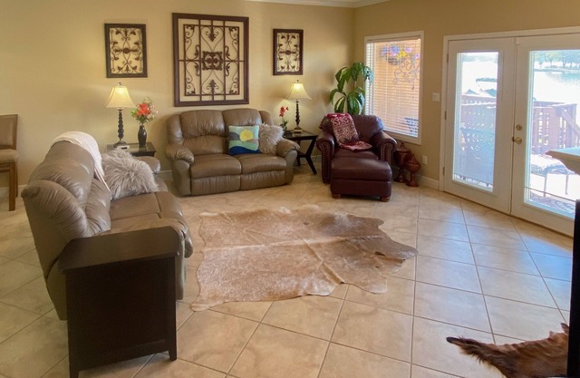 Serene lakefront condo with stunning views, private boat slip, and spacious deck