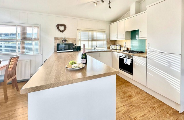 Spacious and contemporary lodge with one king size double with ensuite shower and one twin.