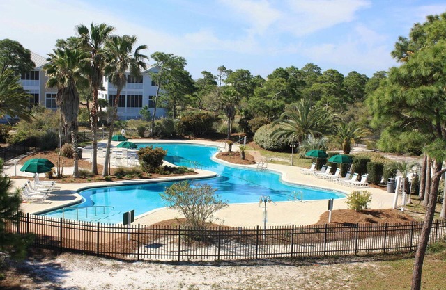 Spacious dog-friendly home with elevator, screened decks, on-site pool, & gym