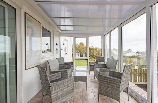 Spacious holiday home with panoramic views of the sea and golf course