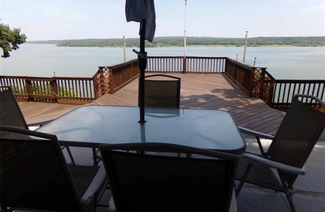 Spectacular lake view with a huge deck and a Hot Tub.