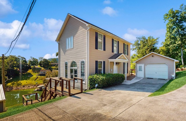 Stunning lake front home w/dock, card tables, wet bar, fire pit & amazing views!