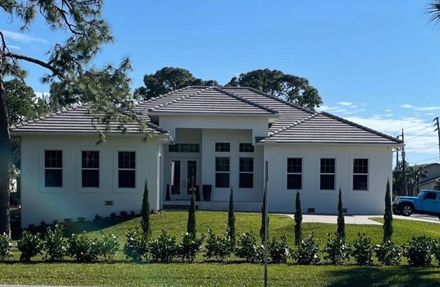 Stunning Newly Constructed Poolside Retreat Across from golf course