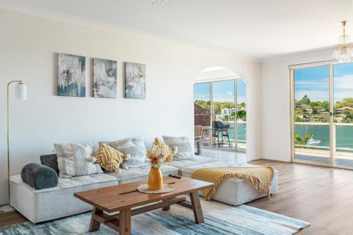 Stunning waterfront townhouse with shared swimpool, harbour view and free P