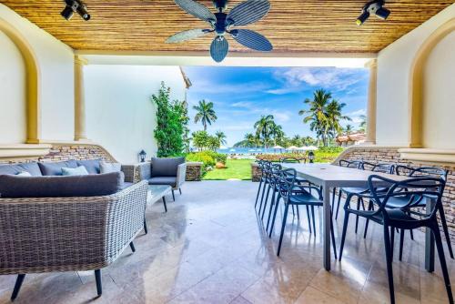 Stylish Split-Level Condo with a Shaded Terrace, Direct Beach Access, and Resort-Style Community Amenities