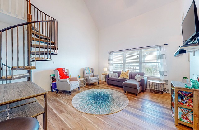 Sunlit, two-story condo with pool, walk one block to the beach