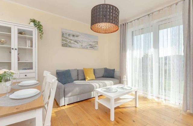 Sunny Apartment with Parking & Garden by Noclegi Renters