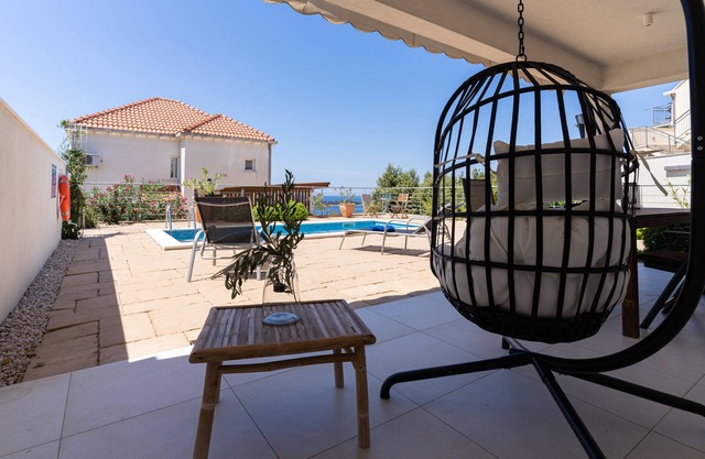 Sunny hill apartment with private pool and magnificent seaview