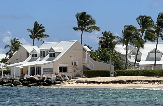Sweet Home SXM Baie Nettlé Feet in the water on the beach