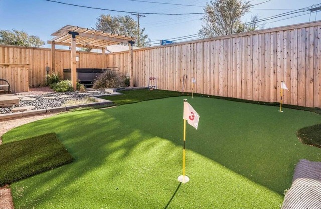 The SuiteSpot Hot Tub EV Charger Mini-Golf Private Yard, Sleeps 6