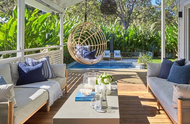 This home matches quaint beachside charm with luxurious comfort.