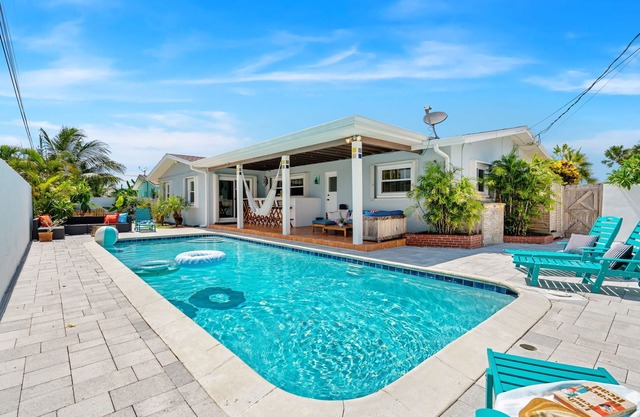 Tropical Retreat: Indian Harbour Beach Home with BBQ Grill, Fire Pit, Private Pool & Hot Tub! 🌴