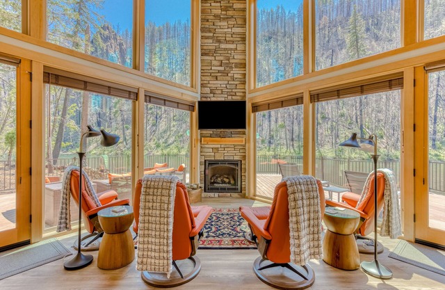Unique riverfront home + cabin with amazing views, deck, & W/D - dog-friendly