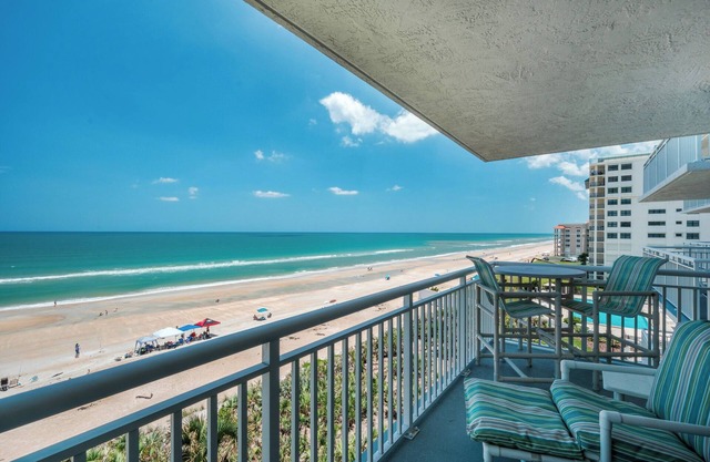 Updated direct oceanfront condo with a private balcony, heated pool, and beach access