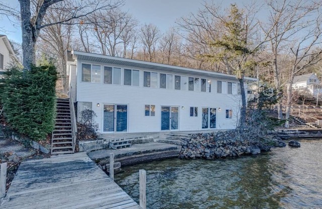 Vacanza Sleeps 12 with 3 individual units and 3 Docks steps from the Lake