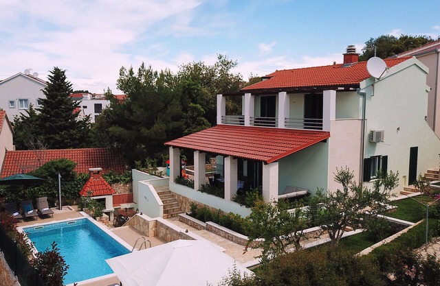 Villa Marina with a heated pool