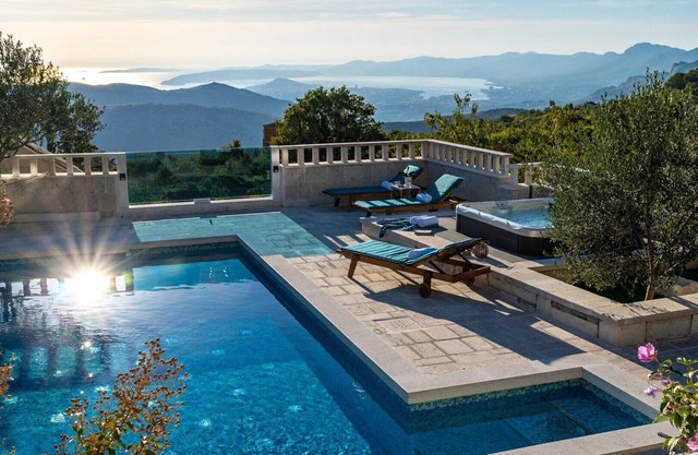 VILLA RUNJE- STONE BEAUTY with heated pool, jacuzzi, amazing view on Split & sea