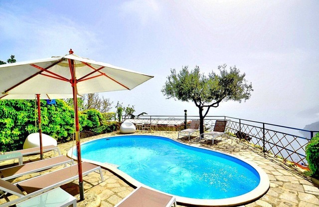 Villa Tecla A: A characteristic two-story independent house located on a hillside, facing the sea, with Free WI-FI.